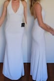 The top of the dress fit well. Around the hips it was very snug (even though I have slim hips). The mid of the dress (around the tummy) was loose which gave the dress an odd look. This dress would look much better on someone with a more traditional pear-ish figure. - Laura H.
