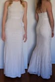 This dress is lovely. It fits well but is not too restricting. The ribbon detailing around the waist give the illusion of a more curved figure which I love as I am very slim hipped. - Laura H.