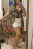 I ordered a L. It wouldn't button w/ my bra & tank top so I removed both.  The elastic bands that holds the buttons stretch far, but I made it work & its not see-thru to the point where u can see my nipples. So I feel comfy not wearing a bra w/ this. The length is perfect and it flows as I move. I pair it w/ destroyed jean shorts to give it a classy yet casual look. I can wear to beach, pool, date night, out to dinner or maybe even a club. Cant wait 2 wear it in Orlando, Fl at my Couple's Retreat vacay & 45th bday gathering!!! - Sharlene S.