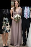 This dress is very flowy and not heavy. Because of the low neckline, I didn't wear a bra with it, but separate bra inserts instead. I probably should've chosen the adhesive kind, looking back, as I was worried that mine would fall out. The chest is a bit open if you don't have enough to fill it up. In person it is between a mauve-grey and a lavender (which is the color I was looking for). I thought it looked great in person, and I got many compliments on it :) - Lora D.