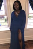 I'm a pretty petite woman and didn't put on a lot of weight during my pregnancy. So with my 8 months stomach, I was able to fit a small. It was a long dress in length but still fit very well and everyone at my baby shower loved the dress. I would definitely recommend! - Erica B.