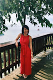 This jumpsuit is the best! I bought it for a friend's wedding and was a bit concerned about the length as I'm short and it's supposed to be a midi...But it actually went down to my ankles and looked just fine like that, so I didn't even have to hem it! The intimate area was quite low (mid-thigh), but because it's a wide leg, it didn't look weird. General fit was perfect for me as I am quite small, but for someone a little bigger, I could see it being tight under the arms. The tie at the front makes it adjustable, so not a problem for someone who is a bit bustier. Would definitely recommend, got rave reviews from all my friends, and I can't wait to wear it again! - Stephanie M.
