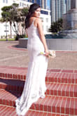 I was soo pleased with the quality & detail, it was absolutely beautiful and everyone loved it as well; they even thought I got it from a bridal boutique! I got married outdoors at the courthouse but still wanted to feel like a bride & this dress did exactly that, it was romantic & a little boho & the train added just that extra bit wow factor on a simpler dress.
I wore 4 in heels & my feet peeked out of the front a bit but I personally didn't mind. The straps are slightly adjustable, so if you are a little bigger in the chest they might be a little tight & you might need to size up. - Heather M.