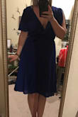 I got this dress as a possible option for a wedding. It fit perfectly and I didn't have any complaints about the dress other then there wasn't a wow factor. It was just sort of plain. The slit from the wrap didn't show much leg either so it left me feeling very underwhelmed. I would probably wear this to work with a bandeau or cami. - Kelly D.