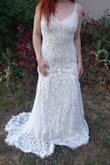 I am very impressed with this dress. I have decided to wear it on our wedding day. The lace is very pretty, and the train is lovely. I might have to have it altered though. I'm on the short side and it definitely drags. I do think that a small would have worked. I might order a small one just to compare the two. - Taylor P.