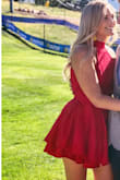 I originally ordered this in a L, but had to return for a M. It fit perfectly. No bra needed. I am tall, so it was short on me, but that was expected. I wore this to a wedding and it was outdoors, I wish I had sewn weights into the dress because I'm sure some people got a show when the wind blew! You cannot twirl in this dress ;)
When I would sit down, my entire bum was on the seat, no dress to cover so that was difficult. Also the high neck made it feel like I was being chocked at times. Overall, it was good for a few hours, but I didn't love it. - Brynn K.