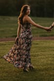 Beautiful dress. The snap comes undone easy but I sewed it and that was an easy fix. Adjustable straps. Plenty of length, I wore it with wedges. - Jessica G.