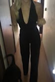 I love this jumpsuit! I was worried it wasn't going to fit because I needed length but also have a lean figure. I got a small so it would be form fitting and was worried the small would be too short. It fits perfectly! There is enough length in the legs and I can even wear a 2' heel with it! The top half fits my body snug but doesn't feel restricting. I will not need to wear a bra under this because of the fit but someone with a larger chest might have a harder time. I ordered this for an event and I am even more excited for the event now that I have this jumpsuit! The price is great and I want it in more colors! - Anna B.