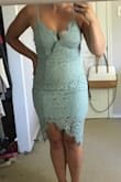 The dress is very well made, gorgeous in person. I'm a M in everything but wanted this dress so much that I was willing to risk a S (only one avail at the time) and it is a tad snug but I'm totally fine with that. You won't regret buying this lacy dress :) 2nd photo shows the colour better. Also, there is a "flap" at the front that you can see in the 2nd photo but just pin in when you wear it. - Lindsey F.