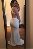 The dress is stunning! I ordered originally in hopes of wearing for my bridal shower. When I put it on however I realized how it's inappropriate for the occasion (day time shower). My fiance loved it but for what I needed it for I felt it was a little too much. If you are a curvy gal it will show allllll your curves. Still a gorgeous dress just not what I needed it for :) will be returning. - Allison G.