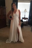 I absolutely love this dress. It is a little big in the breast area which I already figured but everything else fits perfectly. I love that the slip is thick enough that it is not see through but it is still light weight. The is the most amazing dress ever! And I cannot wait to wear it on my wedding day!! - Ashley D.