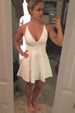 I absolutely adore this dress. It fits perfectly and the back straps aren't loose or too tight. The slip underneath is a little snug, but I think it helps it to stay in place. Love the neckline, not too revealing but still super sexy. - Danielle S.