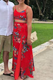 I bought this for a wedding in Jamaica. I'm always between a Small and a medium at Lulus and I wish I had ordered a medium but the small still fit. This looks beautiful and feels very well made. The skirt is multiple layers too! The top definitely runs small. I'm a small 34 B and the medium would have been better. Also it's totally telling enough for me which is always an issue for me at 5'9". - Danielle K.