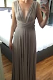 My friend is getting married and gave us a list of dresses to choose from for bridesmaid dresses. I ordered this and another one. I was afraid the material of this dress would look cheap beside the other more "chiffon" styles but I was so wrong. The material has a slight shine to it and looks beautiful beside other fabrics. Also it is SO comfortable!! And incredibly flattering. I love how the fabric hangs and how you can wear it different ways. It fits great, I'll just need a couple inches hemmed off the bottom. My only complaint would be that I wish it came with an instruction card for how to do all the different looks. - Alyssa H.