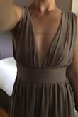 This dress is beautiful, love the material and the long slit. Unfortunately it was a bit big in the breast area and looked baggy on the top. If I had kept it I would have had to have the straps taken in and I'm sure it would have looked great. I was between this and another dress and the other wouldn't have required alterations so naturally I went with the other. If your girls are on the bigger side I'm sure it would look lovely! - Alyssa H.