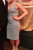 I wore this to a wedding and received so many compliments! I have an athletic build (broad shoulders, narrow hips, flat chested) and this dress fit perfectly. I ordered a large because I have a big rib cage and it fit almost perfectly. The straps were a little loose, but a little dress tape helped everything stay in place. The material is really thick and I felt comfortable with no shape wear. My only complaint is after only one wear the seams were starting to rip. This was very surprising to me since the dress was not tight on me. I'm hoping this was just a fluke on my dress. Customer service was amazing and quick to send me a return label and issue me a refund. Would buy again! - Jes M.