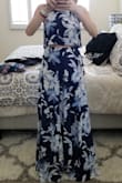 I did not size up and it's perfect, just a bit long. You can adjust the straps on the top to show more or less midriff. Would need to be hemmed as it's too long even with 4" heels. - Mandy M.