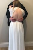This dress is so beautiful and such good quality especially for the price! The sizing is definitely off tho because i usually wear small from Lulus and I ordered medium and it was tight on the back so it made me look like I have back fat lol you can't tell in the pic because I made hubby put his hands over it haha. The dress is also meant for girls with a smaller chest or adhesives because you can only wear a sticky bra so it is much more flattering from the back for me, it looked kind of frumpy from the front because of my larger chest. It was still super cute for our save the date pictures tho! - Melissa V.