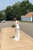 It's a classy, elegant lace gown, perfect for a wedding occasion. It fits perfectly and is best worn with push up bra. The length of the gown is too long for my height, so it's best with 2-3 inches heels. I thought that it's too expensive but it's not. With this gown, you are able to save and at the same time look at finest on your wedding day. - Ciela J.