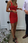 The fit was a little tight but a M would have been too big in the top. The material is super stretchy and the dress is very comfortable. - Mackenzie C.