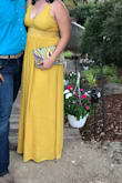 I am usually a medium but because I have larger boobs they are popping out so I decided to go up a size and it just fit! I got the mustard yellow. I really couldn't wear a bra with it because of the cut of the cleavage. I had to wear heels with it. If not, I would be dragging the dress. - Christina E.