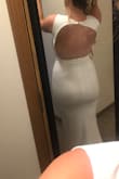 The material was such good quality! It was the perfect combination of stretchy but tight enough to hold everything in without showing every bad thing. I have a bigger belly so I could have worn spandex, but I definitely wouldn't have sized up because I'm so short, the back was a little too long. I returned/exchanged to get a different dress that fit my wedding style more, but this dress was amazing! - Taylor J.