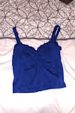 First off, I received this 2 days after I ordered with standard shipping. SO QUICK. Absolutely love this top. Ordered size small & it fits perfect everywhere. The crop is perfect as well, not too cropped and not too long. The ruffle detail in the center chest is very flattering, especially for someone with a smaller chest! I love every Lulus product I've ordered. Highly recommend. - Alyssa S.