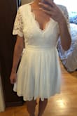 This dress looks perfect in person! Very satisfied with the fit, length and style. True to size with help from the chart and live chat. Definitely recommend! - Brittany Z.