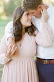 I have REALLY large boobs (36G) but I usually can get a medium in anything. This dress fit me every where but my chest. It actually fit very awkward in that area, it was loose at the V and I ended up having to safety pin it for my engagement photos which sucked. But she photoshopped! And it ended up looking ok! I would get a large if you're super busty like me and just take it in anywhere else needed... 
But I don't think this dress is meant for girls with bigger boobs! I wish I would have looked for a different one. - Layney S.