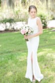 I wore this dress to my wedding reception and I'm soooo happy with my decision! I tried on a bunch of dresses and when I finally got this one I put it on and knew it was the one. It's simple and elegant and absolutely gorgeous. The website pictures don't do it justice. It fit like a glove, although I did have to get it hemmed BC it was too long (even with heels). I was worried about it showing through too much but it's well made and a pretty thick material. Very comfortable too! - Sara G.