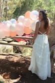 I wore this dress to my bridal shower, which took place at a winery in Malibu, & the bohemian style felt perfect for the occasion! I was torn between several dresses but when my fiancee told me this one was a "showstopper," I took his word for it! Everyone kept telling me that the dress looked pretty enough to get married in, many people asked if it was Free People - needless to say, I received lots of compliments! The front of the dress is so classy & elegant, & the back provided the sexy appeal & wow factor I was looking for! I will probably get it hemmed before I wear it again since I had to wear my highest wedges & even then it almost touched the ground, but otherwise it was absolutely perfect! It was comfortable too! I highly recommend it! - Bridget C.