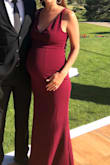 I sized up to a medium and wore this 8 months pregnant to a wedding. The material is stretchy and comfortable! It felt great all night. - Tiffany A.