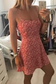 I got so many compliments when I wore this! Material is lightweight and doesn't wrinkle. The tie straps in the back allow you to adjust to make it a perfect fit! - Megan K.
