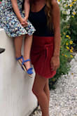 I love the color and suede material of this skirt. It's a little loose and the tie is just for show but it fits nicely! Can be dressed up or down. - Ashley B.