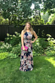 Love love love this dress!! Wore it to a wedding and then out afterwards and got tons of compliments. The tie back is so sexy and easy to manuever on. I have a big chest but it fit perfect and they didn't hang out or feel pushed down or anything. Must buy! - Meghan P.