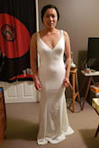 Fit perfectly!! Slightly long, as I am not that tall but that's an easy fix. The material was surprisingly good and have some solid weight to the dress. The beads were tightly sewed together (no gaps). However, there was a couple of strings hangout - can be trimmed off. I had to return this dress as the other dresses I ordered have a much comfortable cutting to my curves. - Tammie L.
