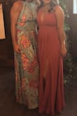 This dress is so beautiful on! The only issue was how hard the zipper was. I got it hemmed but the slit was in a perfect place for me even though I'm a shorty :) - Daniella J.