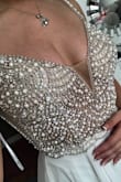 Pictures don't do it justice. World's most amazing dress, I have to get it hemmed a lot and maybe the straps in a little but I can't wait to wear it at my wedding. The description says 60(ish) inches from shoulder to hem which definitely isn't true so unless you're tall you will have to hem. But other than that, it's perfect. Just what I pictured. Light enough fabric for a casual wedding but heavier fabric which makes it seem more expensive than it is. - Crystal T.