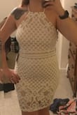 I bought this to wear to my bridal shower. I would definitely suggest ordering a size up. I am normally a medium, but in a large this fit well. Definitely find some sort of stick-on bra or plan to not wear one due to the low back. I would honestly have to say that the fabric felt too thin and not quality for the price, since the lining is 100% polyester. - Renee T.