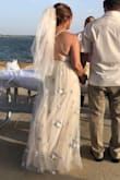 I ordered this dress to wear as my wedding dress. The wedding was an outdoor summer ceremony by a lake at sunset. This dress fit well. I am short so I expected to hem it and only cut off 3 inches. Love the adjustable criss-cross straps in the back! Comfortable to wear, the dress is 'flowy' and comes out great in pictures. I will be able to wear this dress again to a special occasion. Liked the Beige color. It was easy to match the color with a beige veil. I also liked the pastel embroidered flowers on the Thule layer of the dress. Great value for the price! - Juana D.