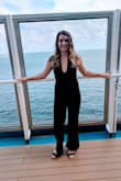 The material is so comfy and stretchy! It's thick, but not too thick. It was the perfect length. The neckline is low-cut, but not too revealing. The back is very nice. I love this jumpsuit and would highly recommend it if you are on the fence. - Alyssa S.
