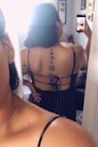 I've worn this dress 5 times since I purchased it! The material is nice and airy - no stretch but the ties on the back are helpful to tighten or loosen the chest area. The length is above the knee for my height. Perfect for us girls with some back rolls that would like to wear backless without the FULL commitment - if ya know what I mean! That being said, I noticed some fuzzies or pilling around the chest area. Nothing that can't be fixed. - Jennifer M.