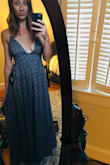I love this dress. Its flirty and whimsical. The straps adjust nicely with a very tight knot. My only complaint is a personal style preference. There are long strings that hang from the ties on the straps. They hang behind you, and are pretty long. They have tassels on the end. I just don't like that detail. But I will keep the dress and slightly alter the strap. - Ashley T.