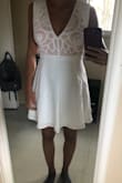 Love this dress. I was looking for a more formal white dress for a while and this one finally fits me perfect. It flairs our but not too much. Light material and a super cute top section. - Laura S.