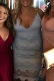 Ordered this for a wedding and I'm about the order it in the white too because I love it that much. The straps are adjustable so that works out nicely, a little loose around the mid section but I would be afraid with this type of material to order the medium. Over great purchase. - Hilary L.