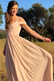 Beautiful dress! Wore it as a maid of honor dress. Received many compliments. Can wear with or without a bra. Dress is long, but is perfect with heels. - Kat P.
