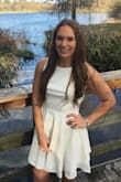 This dress was looked excellent in my college graduation photos. It flowed outward perfectly and really showed off my back well. I have a large rib cage so I did find it a little too snug in the lower back, but I didn't find a need to exchange it. Very classy and cute dress that I got many complements on! - Alycia L.