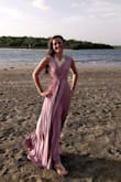 This dress is amazing! So comfortable and there are so many more ways to wear it than the 12 suggested! I played around with it and wore it to a wedding in Costa Rica as seen in the photo. I would suggest fashion tape as the possibilities are then endless I think. - Chassidy R.
