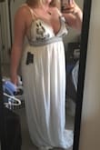 This dress is ridiculously beautiful very boobilicious though and verrry long definitely had to get it hemmed. But I LOVE IT. - Stephanie H.
