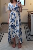 This dress is adorable. I ended up returning it because I liked another one I ordered just that much more. It is very light, fun, and flirty. Fits true to size based on the size chart. It is a true wrap dress so it took me a minute to figure out how to tie it. - Mary B.